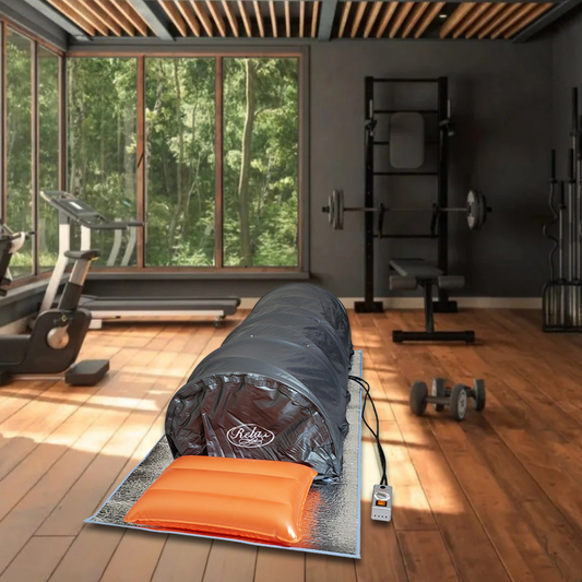 Relax Flex lie-down sauna set up on a home gym floor