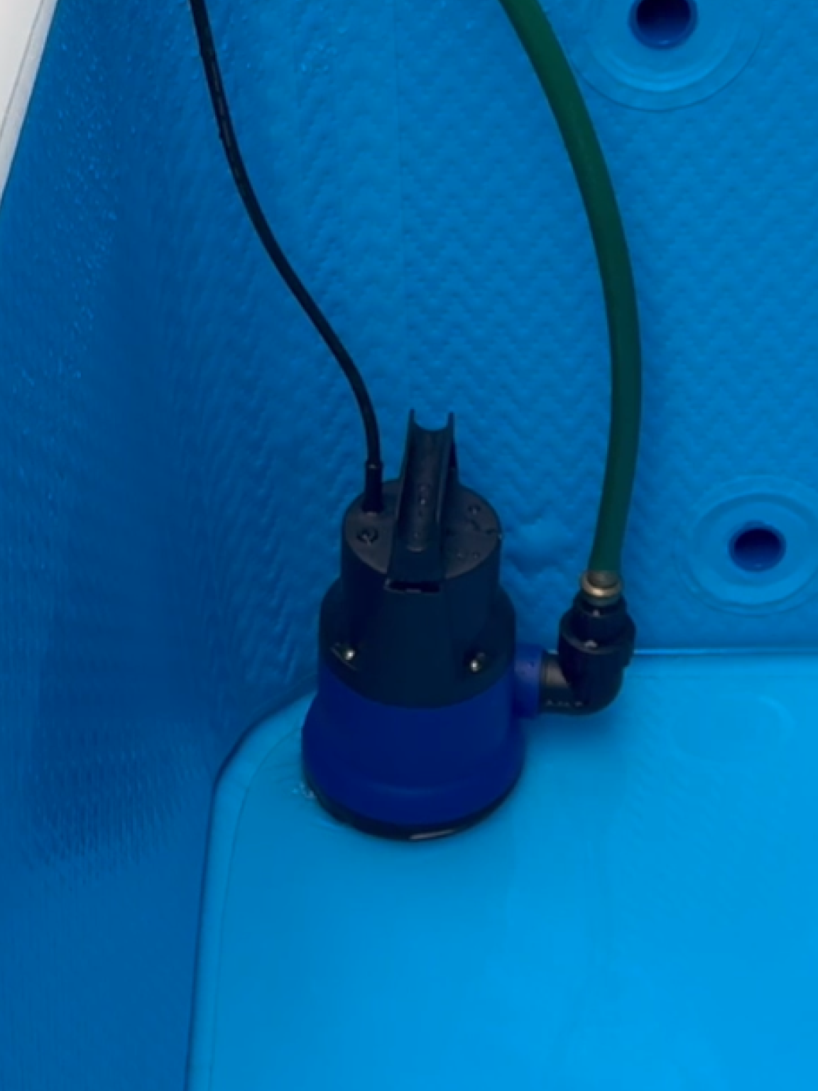 RevX drain pump submerged in a cold plunge tub