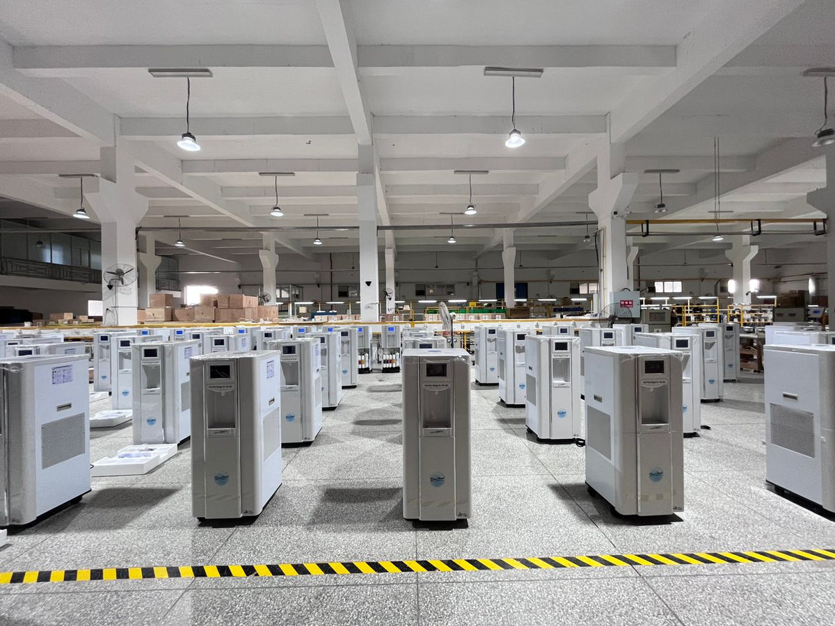 Rows of DewStand atmospheric water generators in the warehouse