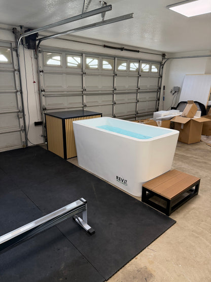 RevX Acrylic X Tub cold plunge set up in a home garage gym