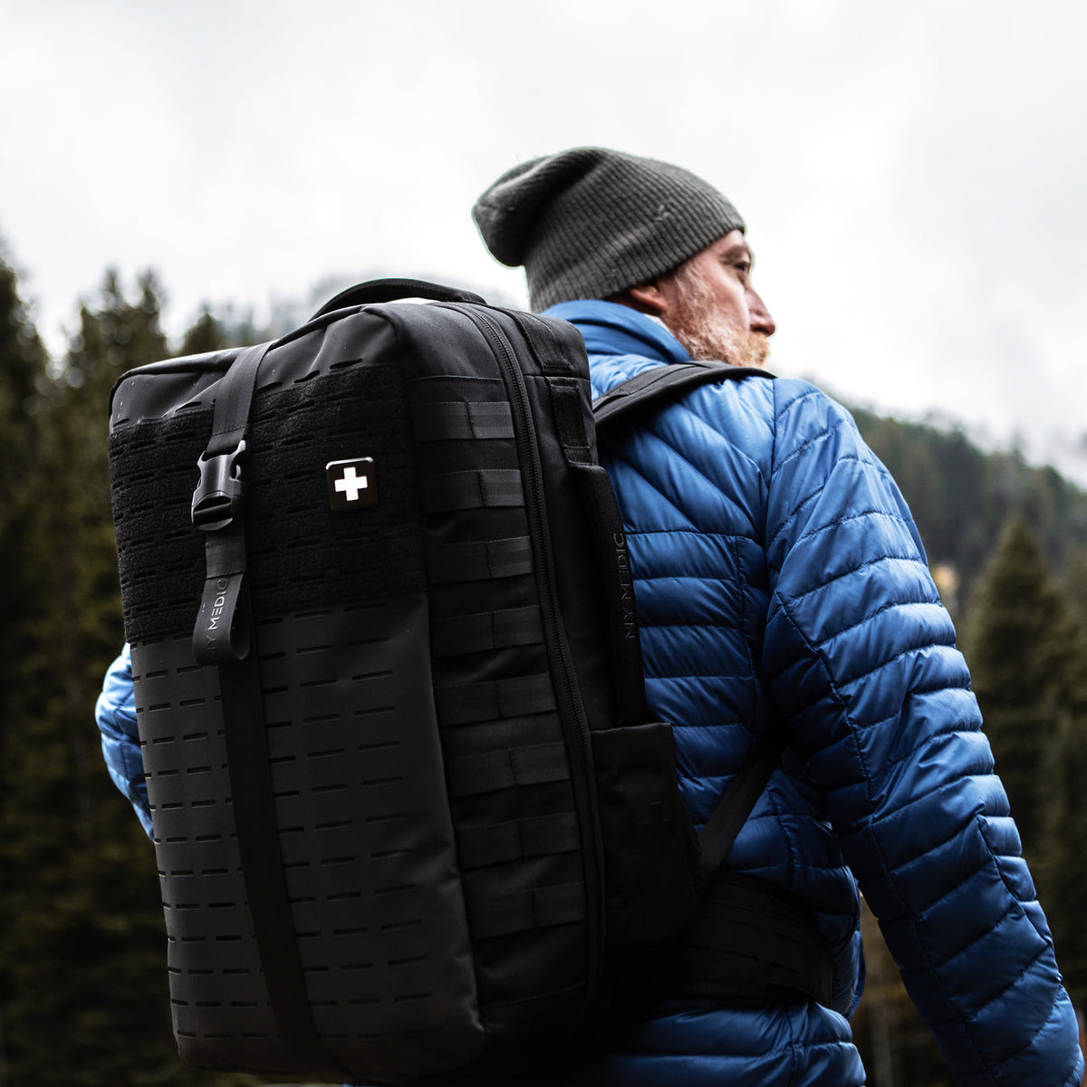 Man wearing The Medic PRO medical kit backpack outdoors