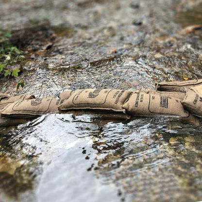 StormBag flood barrier bags diverting flowing water