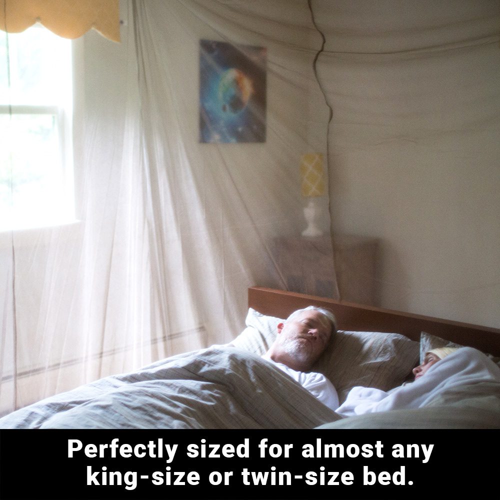 Man sleeping under the SYB Faraday bed canopy