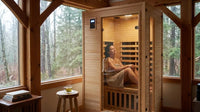 Woman relaxing in 1-2 person hemlock infrared sauna