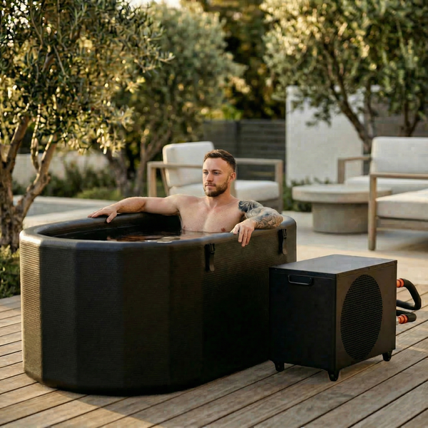 Man relaxing in the Nicebeam Cryo Pro XXL inflatable cold plunge on a patio