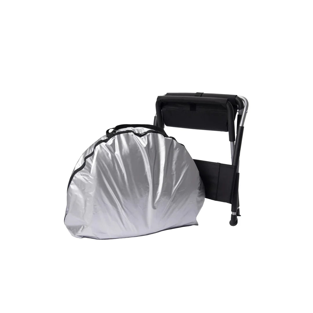 Relax Silver Elite tent sauna folded in its carry bag beside the folding chair